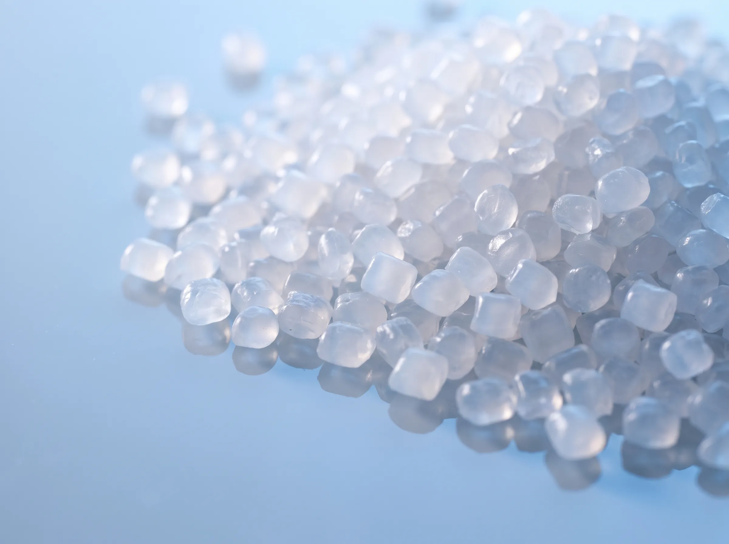 Close view of translucent polymer pellets